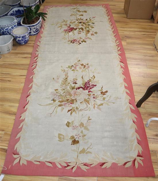 An Aubusson style carpet 320 x 125cm